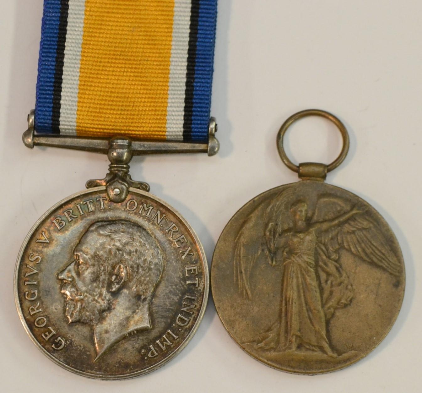 Medals, World War I, a pair, British War and Victory, named to 214324 Gnr H...