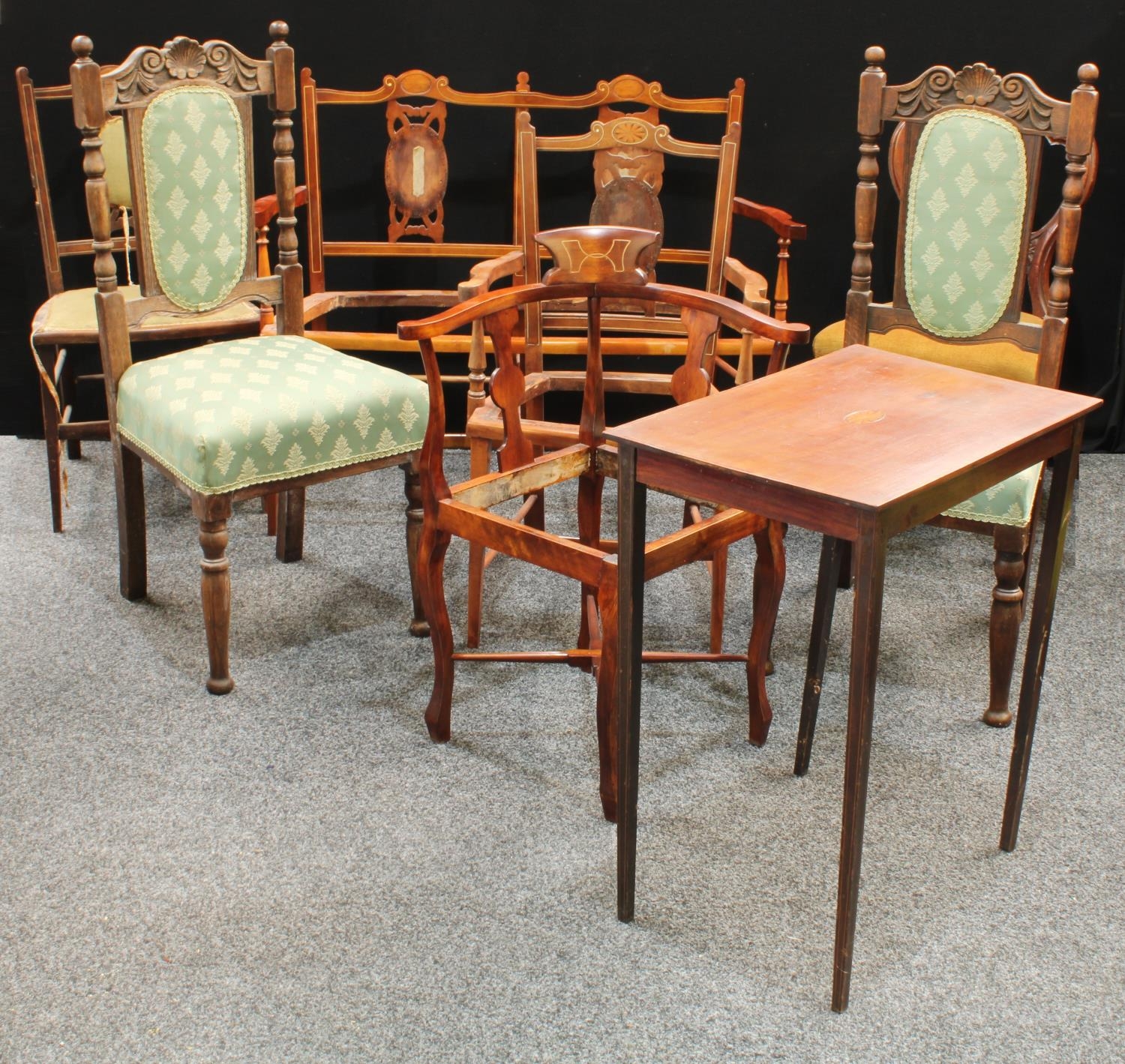 An early 20th century mahogany three piece salon suite, for restoration; a...