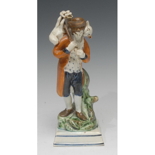 33 - A Staffordshire Pearl Ware figure, The Lost Sheep Found, the shepherd wears a mottled blue coat and ... 