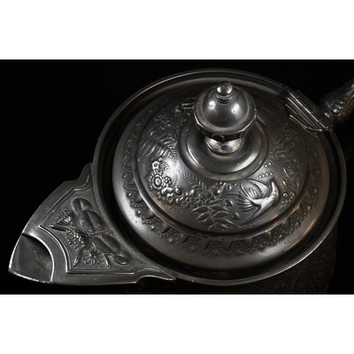 5054 - A 19th century pewter baluster flagon, elaborately cast  in relief with parrots in reserves of exten... 