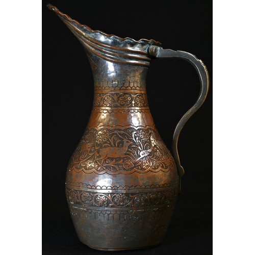 5053 - A 19th century Persian tinned copper baluster ewer, typically chased with deer, birds, and flowering... 