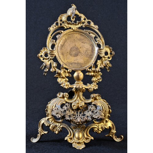 5030 - A 19th century French Rococo Revival gilt metal pocket watch stand, pierced and cast throughout with... 