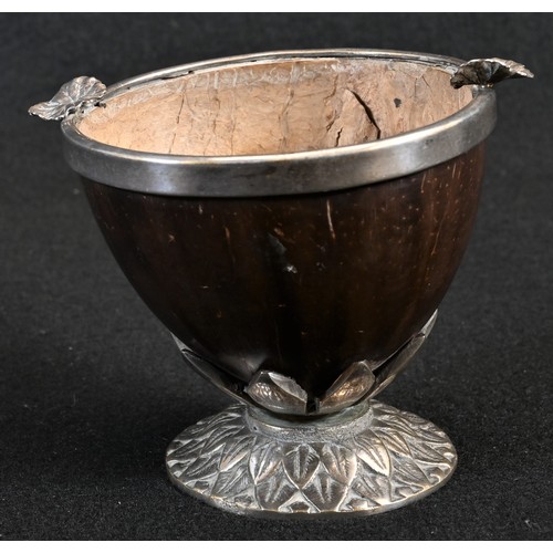 5017 - A 19th century coconut cup, the silver plated base cast with lotus, the rim applied with vine leaves... 
