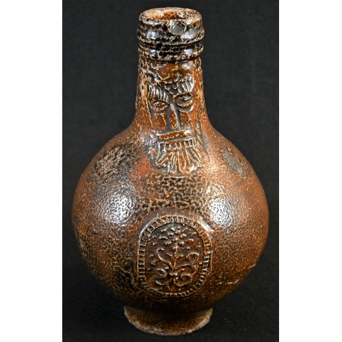 5004 - A 17th century tiger glaze stoneware bellarmine, bearded mask above a stylised floral medallion, loo... 