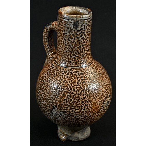 5002 - A 16th/17th century tiger glaze stoneware bellarmine, loop handle, 22cm high, c.1580 - 1650