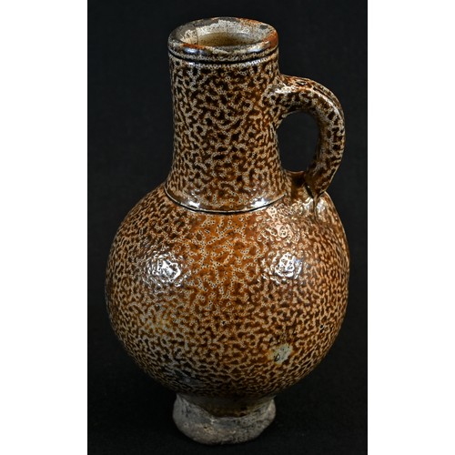 5002 - A 16th/17th century tiger glaze stoneware bellarmine, loop handle, 22cm high, c.1580 - 1650