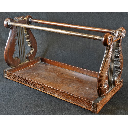 5006 - A 19th century Anglo-Indian hardwood book carrier, lyre-shaped end supports carved with scrolling ac... 