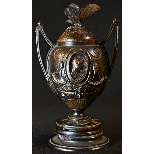 5012 - A 19th century brown patinated bronze, cast with portrait ovals, butterfly finial, belge noir base, ... 