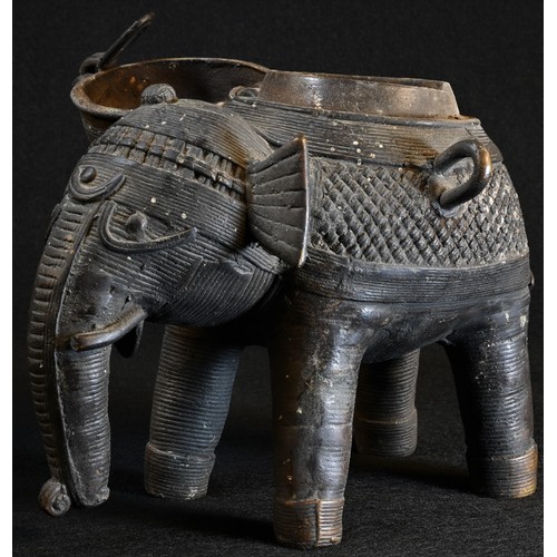 5038 - A 19th century Indian dark-patinated bronze censer, as an elephant, the hinged cover as a stylized h... 