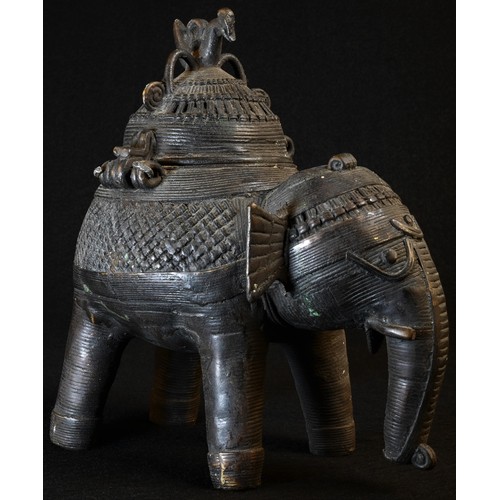 5038 - A 19th century Indian dark-patinated bronze censer, as an elephant, the hinged cover as a stylized h... 