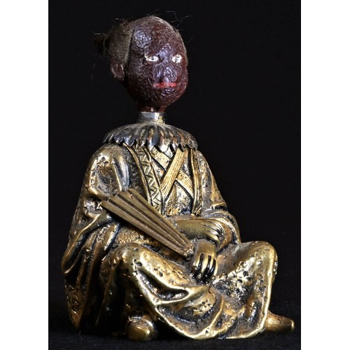 5016 - A 19th century Chinoiserie gilt bronze and composition novelty glue pot, cast as a Chinese man, seat... 