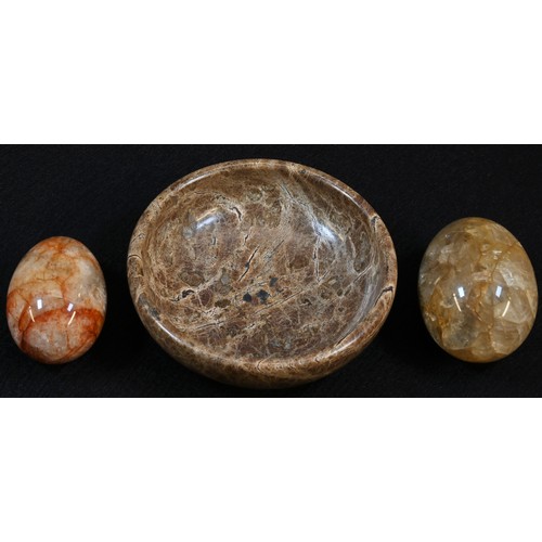 5024 - A 19th century Derbyshire fluorspar egg shaped paperweight, 4.5cm long; another, similar, 4cm long; ... 