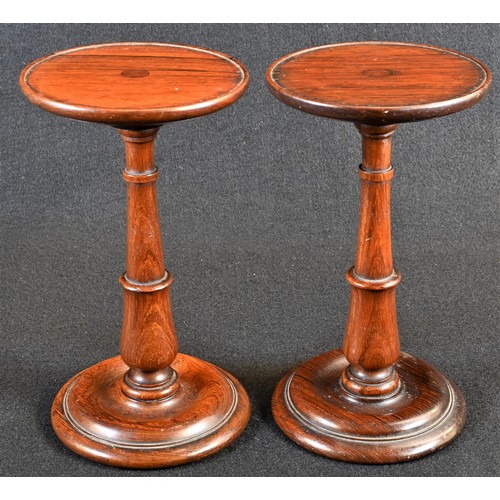 5005A - A pair of George IV rosewood circular candle stands, shallow galleries, turned pillars and bases, 18... 