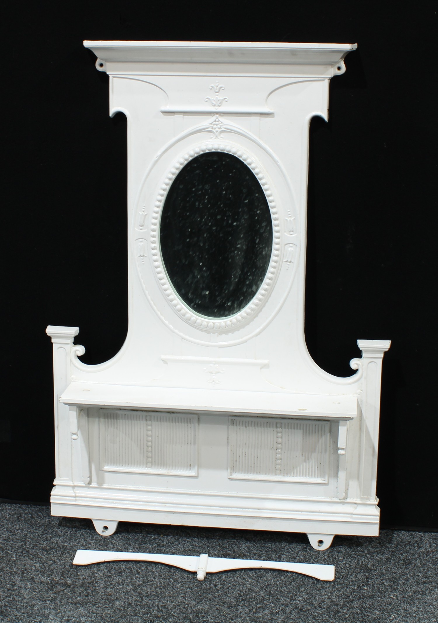 A 'Victorian' cast iron chimney piece, the painted superstructure with an...