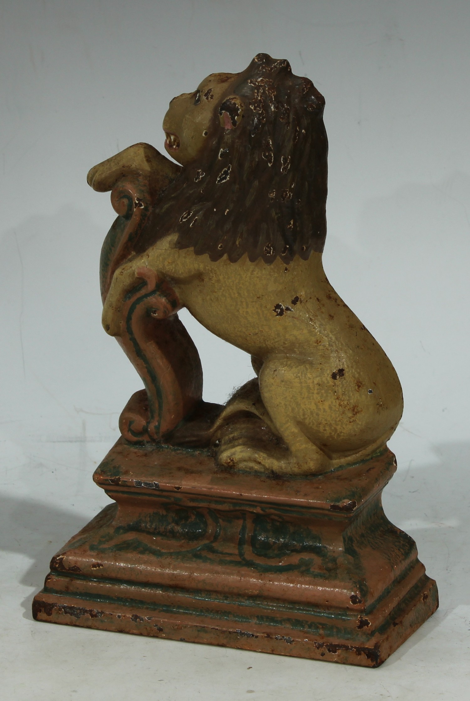 A polychrome painted cast iron door stop, as a rampant lion