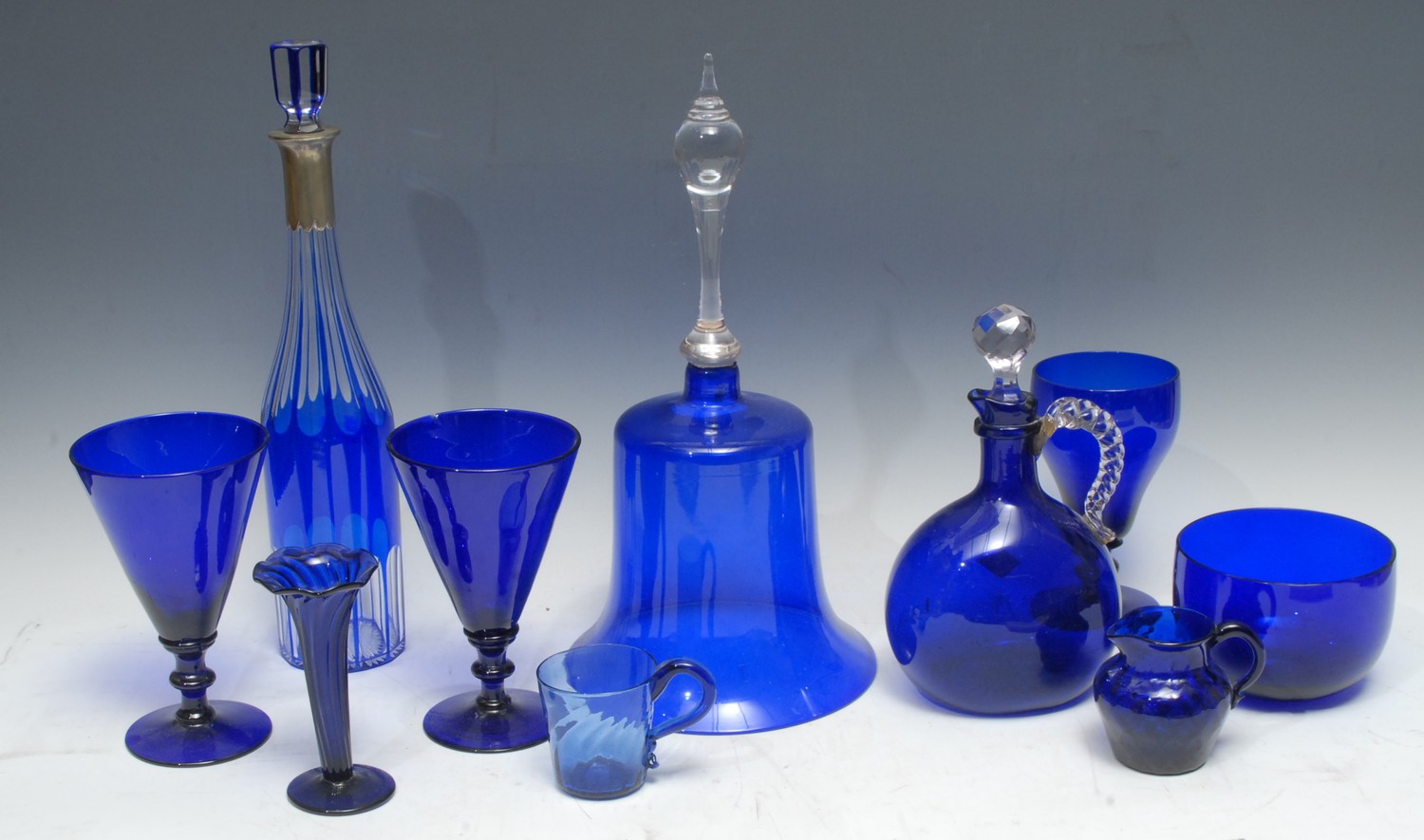 A Victorian blue glass bell, clear glass handle, 37cm high, c.1880; a pair...