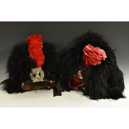 3015 - A Scots Guards ostrich feather piper's dress bonnet, 43cm high; another (2)