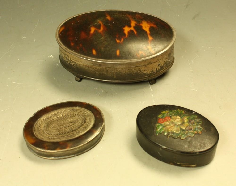 A 20th century silver and tortoiseshell oval dressing table box, the cover...