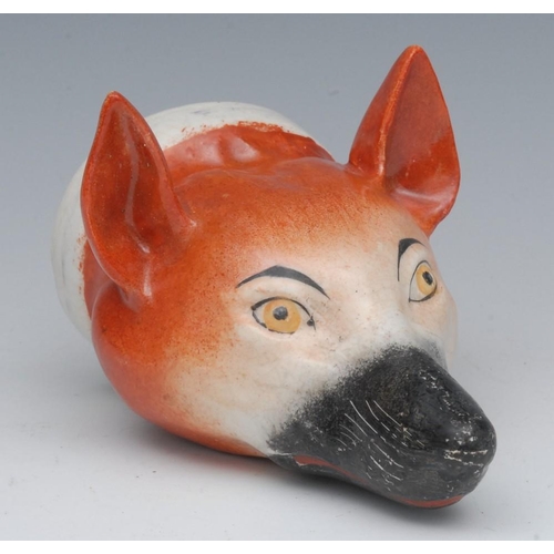 47 - An English pottery novelty stirrup cup, modelled as a fox mask, naturalistically painted, 13cm long,... 