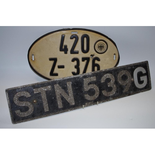 37 - A West German oval number plate from a VW minibus, with bullet hole 420Z-376; another; 1969 Morris 1... 