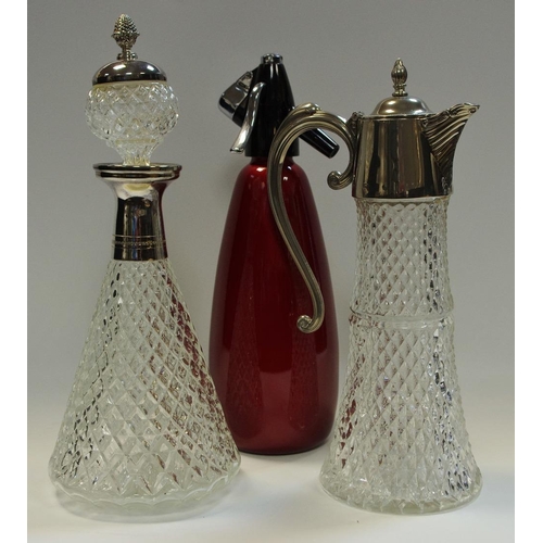 44 - A claret jug with plated mounts; a confirming decanter; a soda syphon