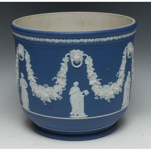 11 - A large Wedgwood Jasperware jardiniere, typically sprigged with classical figures and garlands of fr... 