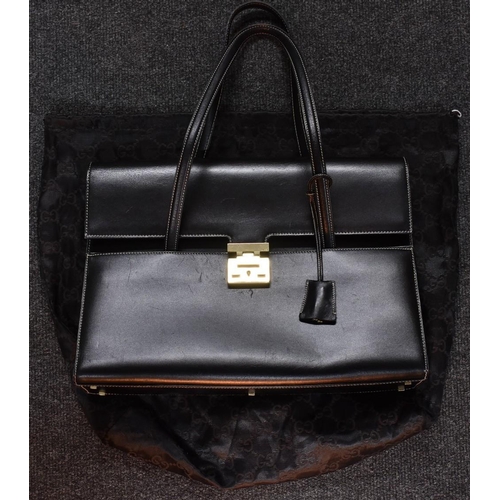4058 - A contemporary Gucci padlock handbag, top handle, black leather, bright scarlet leather interior, ke... 