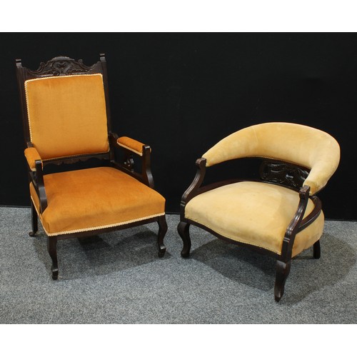 A late Victorian/Edwardian Eastlake style open armchair; a s...
