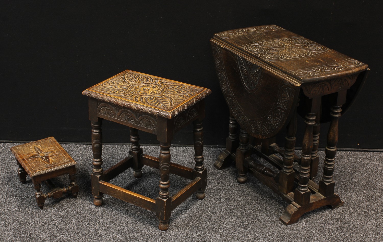A 17th century style carved oak draw-leaf table, oval top, 65cm high, 97cm...