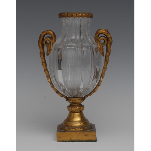 16 - An ormolu mounted crystal fluted ovoid vase, the handles cast as intertwined scrolling vine, square ... 