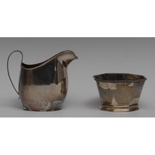 46 - A George III silver helmet shaped cream jug, scroll handle, 10.5cm high, maker R*, London c.1800; a ... 