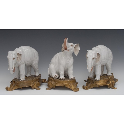 6 - A garniture of three substantial 19th century ormolu mounted Continental porcelain models, of elepha... 