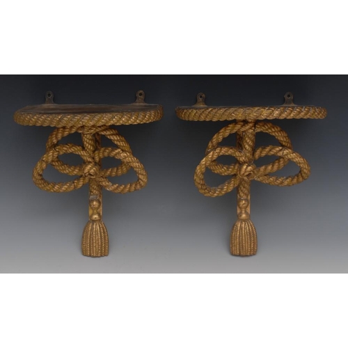 77 - A pair of Adam design giltwood and gesso wall brackets, D-shaped plateaux with ropetwist borders, bo... 