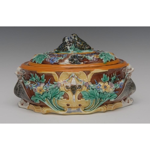 16 - A Wedgwood majolica oval game pie tureen and cover, moulded in relief with  floral swags, dead game ... 