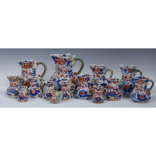 8 - A Masons Ironstone octagonal jug, decorated with large flowerheads and foliage in cobalt blue and ir... 