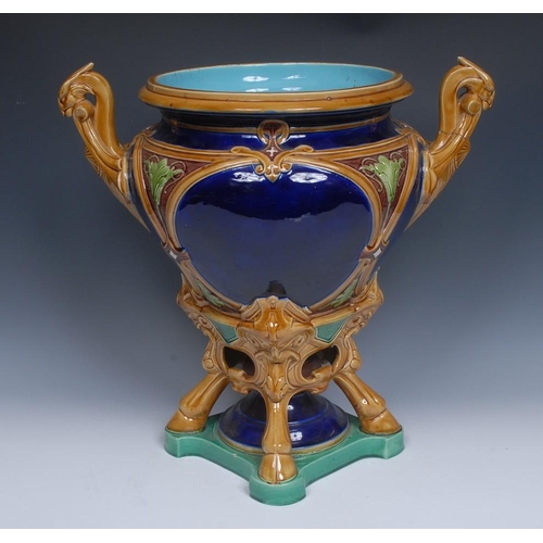 17 - A Victorian majolica urnular jardiniere, probably Minton, moulded with strapwork, stylized leaves an... 