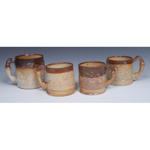 35 - A 19th century Derbyshire salt glazed stoneware mug, applied in relief with hounds at the kill, grey... 
