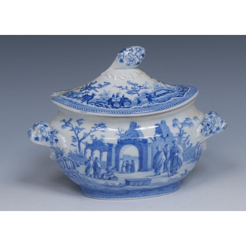 55 - A Spode Caramanian Series oval sauce tureen and cover, transfer printed in tones of blue with Ancien... 