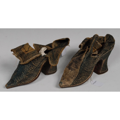 3109 - A pair of early 18th century lady's shoes, embroidered in stripes with raised turquoise thread, leat... 