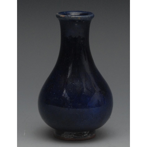 15 - A Chinese bottle vase, glazed in blue, 10cm high