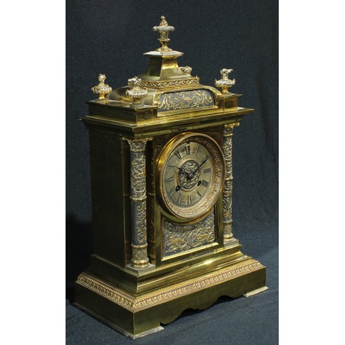 41 - A Victorian brass mantel clock, Roman numerals to dial with twin winding holes, the dial inscribed J... 