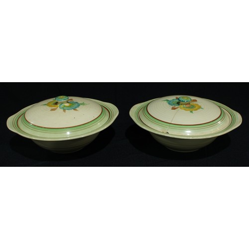 56 - A pair of Clarice Cliff vegetable dishes and covers