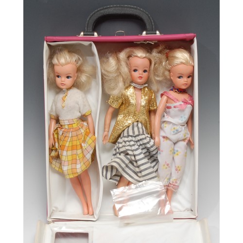 2023 - A vintage 1970's rectangular shaped pink vinyl Sindy carry case with single clothes hanger; a late 1... 