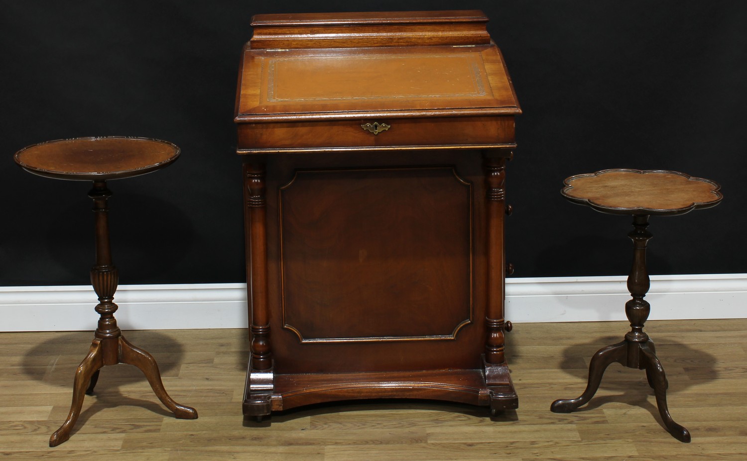 A Victorian style mahogany Davenport desk; a George III style wine table...