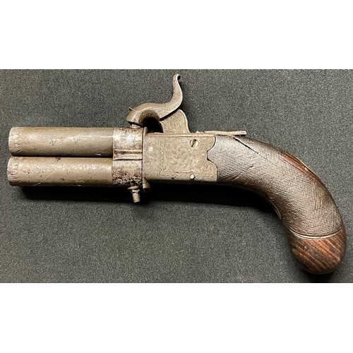 40 - A small revolving double barrel Percussion cap pistol. Barrel length 67mm. Heavily rifled bore appro... 