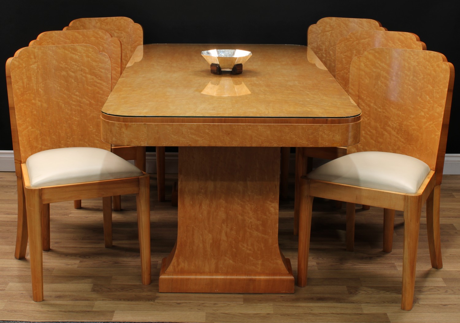 An Art Deco birdseye maple dining table, rounded rectangular quarter