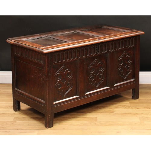 49 - A late 17th/early 18th century oak three panel blanket chest, of small proportions, hinged cover, nu... 