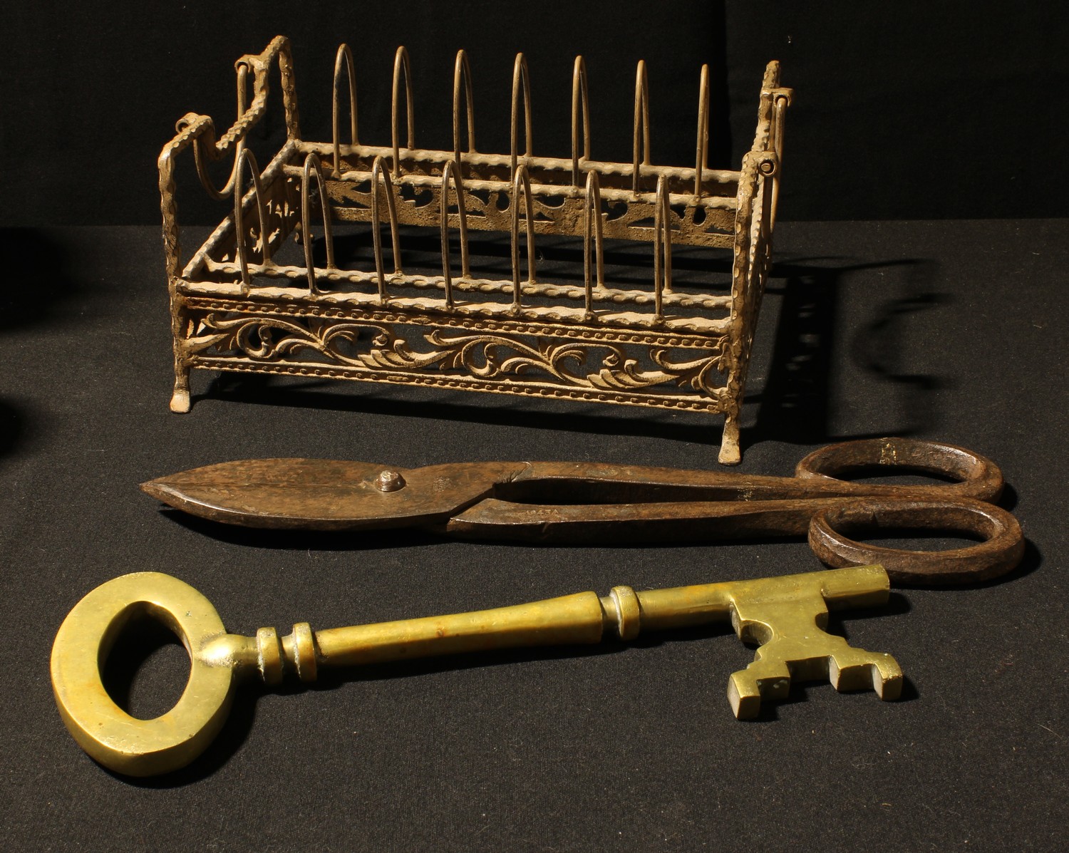 A large pair of blacksmith's shears, 41cm long; a large brass key, 35cm...