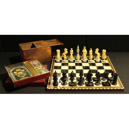 A novelty chess set, plastic figural pieces in medieval dress, a