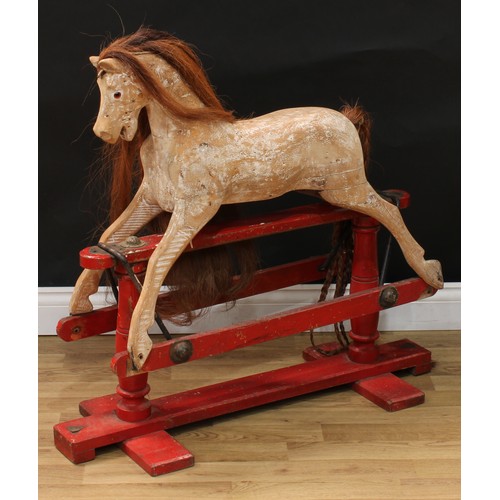 2018 - An early 20th century Lines Brothers rocking horse of small proportions, the stripped and carved woo... 